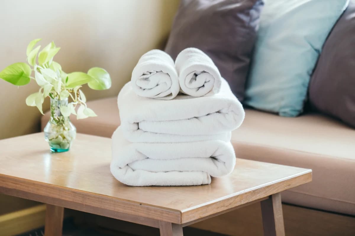 Fresh linen stacked neatly for changeovers